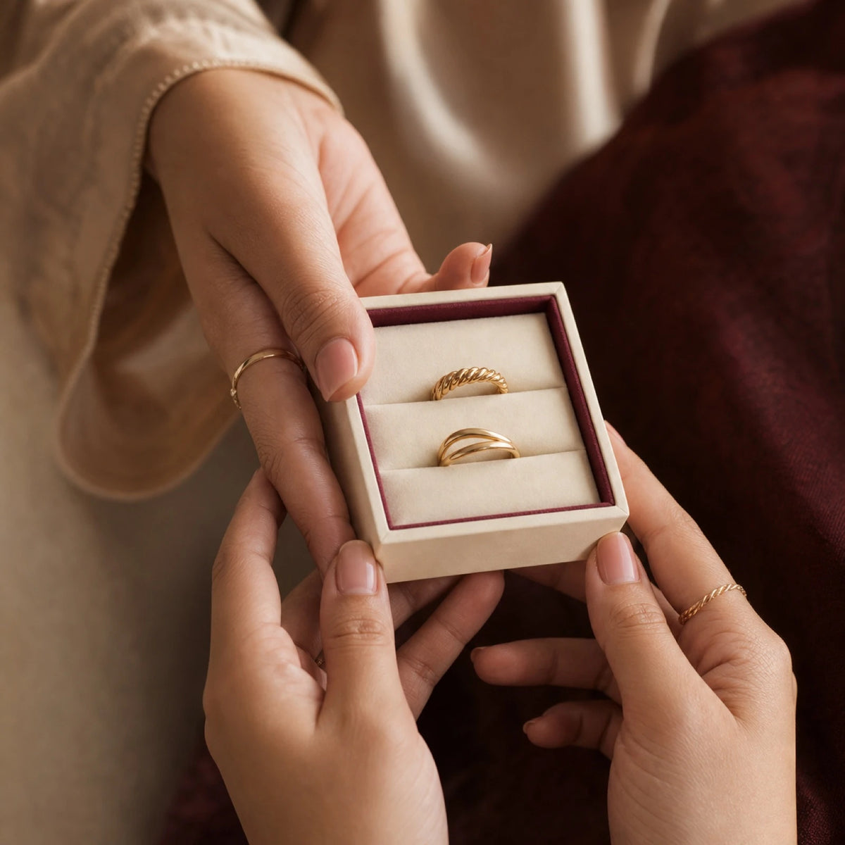 Two Ainaz rings presented together in an open gift box