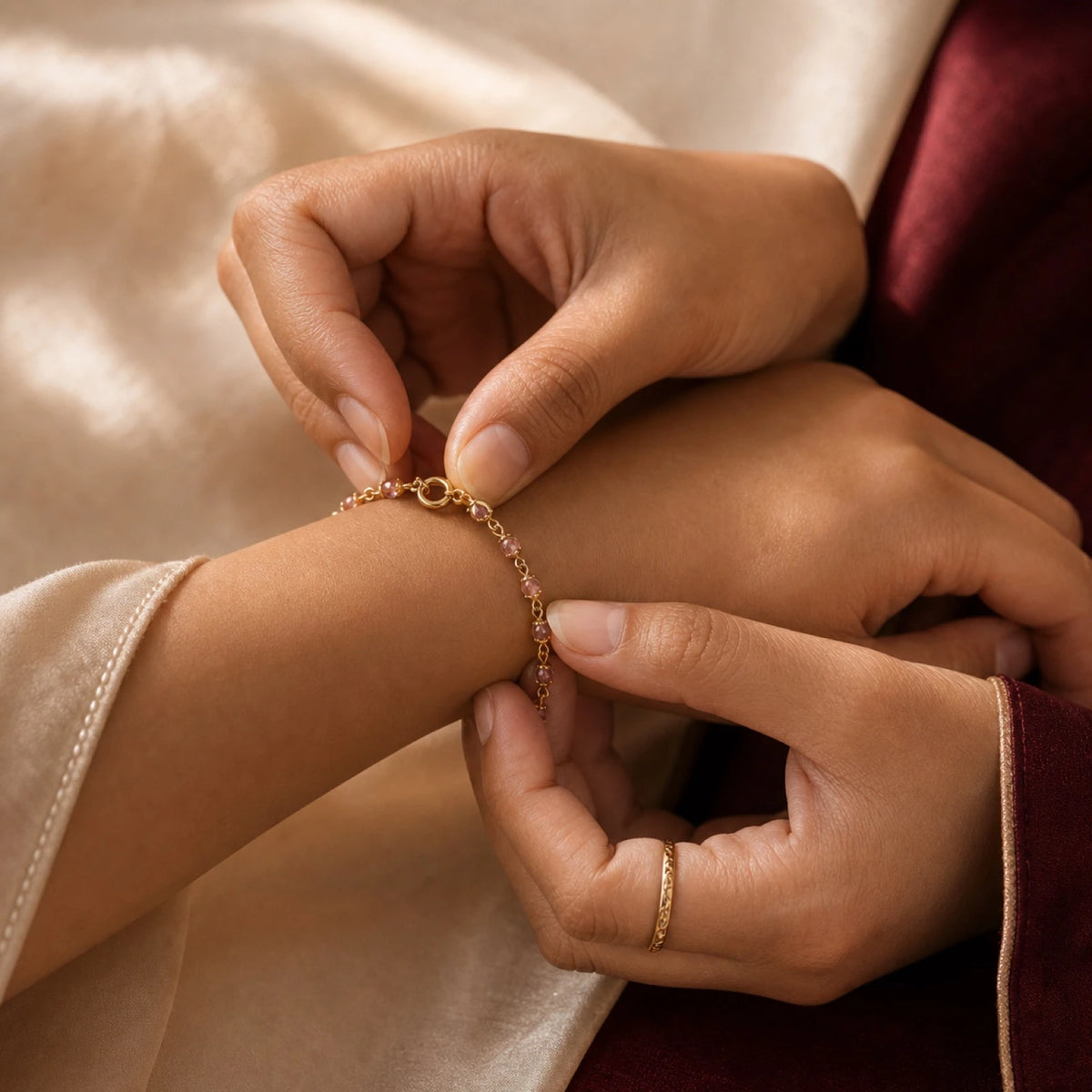 The personal ritual of fastening a gold-toned bracelet